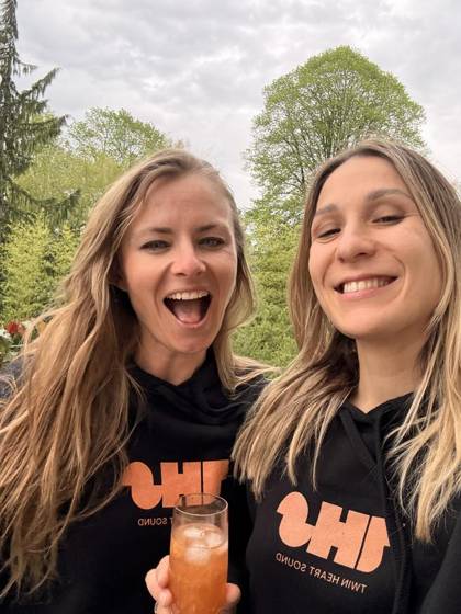 Outdoor selfie in THS hoodies with a drink