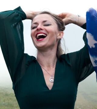 Writer one laughing, wearing green